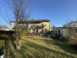 Erdgeschosswohnung in Dreifamilienhaus, großer, eigener Garten, Terrasse, Garage - Hausrückansicht100